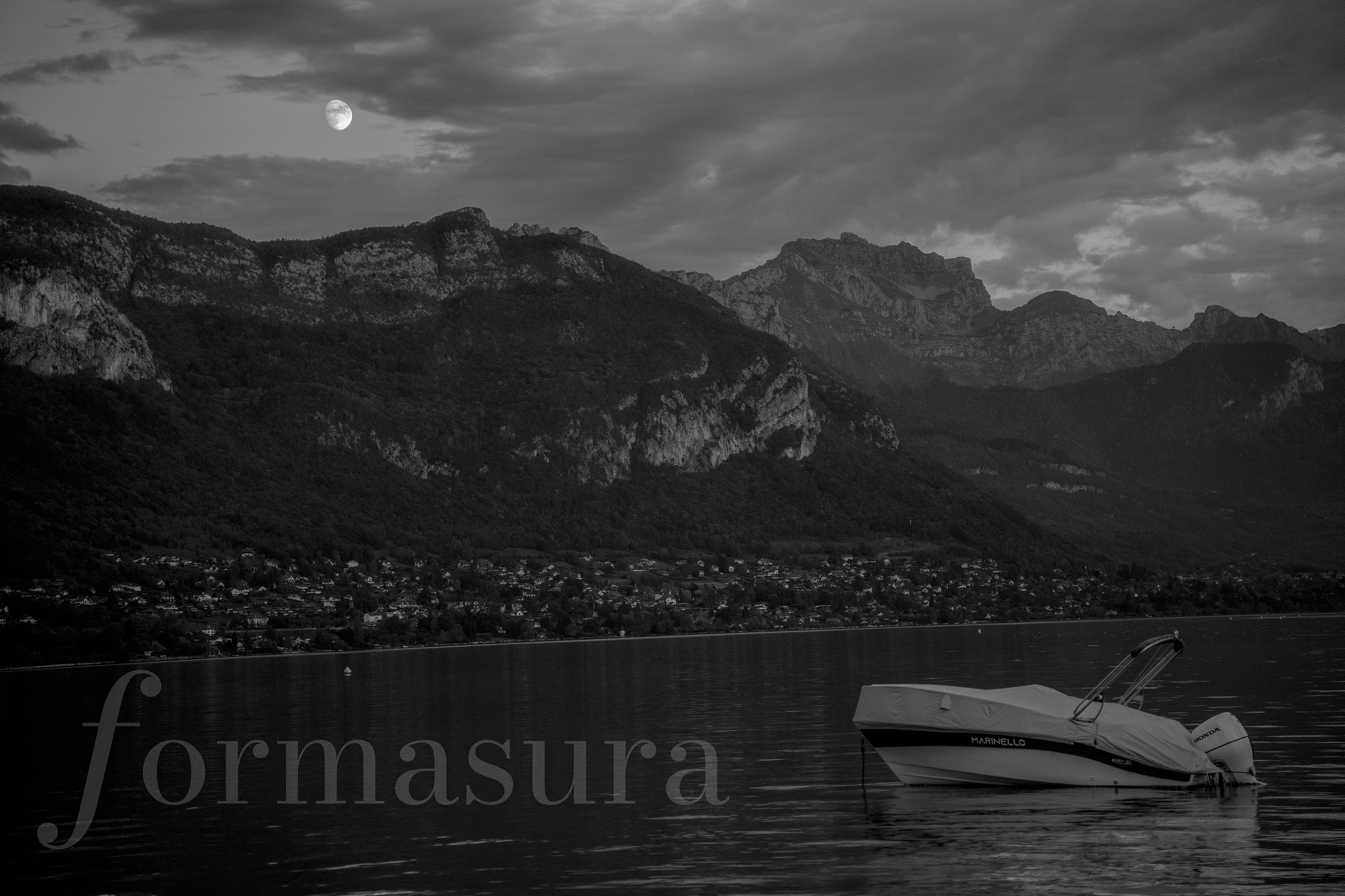 Lake Annecy at night under moonlight